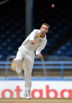 Australian bowler Nathan Lyon delivers during the third day of the second-of-three Test matches between Australia and West Indies April 17, 2012 at Queen's Park Oval in Port of Spain, Trinidad. AFP PHOTO/Stan HONDA (Photo credit should read STAN HONDA/AFP/Getty Images)